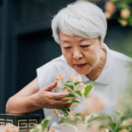Woman smelling flowers